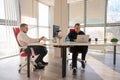 Two Caucasian men working in an office. Royalty Free Stock Photo