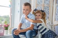 Two Caucasian siblings brother and sister posing. Girl and boy at photo shoot Royalty Free Stock Photo