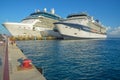 Two Celebrity cruise ships docked side by side