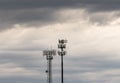 Two cellphone towers providing digital service to rural areas in cloudy skies