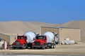 Two cement mixer trucks