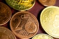 Two cents on the background of other coins Euro cents macro photo Royalty Free Stock Photo