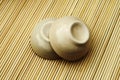 Two ceramic bowl on bamboo matt Royalty Free Stock Photo