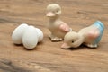 Two ceramic ducks with white easter eggs Royalty Free Stock Photo