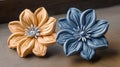 two ceramic flowers sitting on top of a wooden table next to each other on a wooden tablecloth covered table top with a wooden