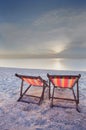 Two chairs beach and sunset Royalty Free Stock Photo