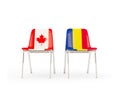 Two chairs with flags of Canada and romania