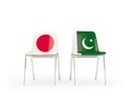 Two chairs with flags of Japan and pakistan isolated on white