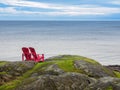 Two chairs overlooking ocean shore Royalty Free Stock Photo