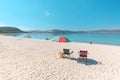 chairs and a parasol on the white sand beach on lake Salda. Turkish Maldives and relax in Paradise concept