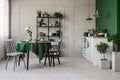 Two chairs at round table set for breakfast in contemporary open plan kitchen Royalty Free Stock Photo