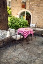 Two chairs and table on summer terrace of old restaurant Royalty Free Stock Photo