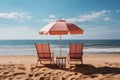 Two chairs and an umbrella on an empty beach, summer landscape image Royalty Free Stock Photo