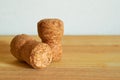 Two champagne corks on a wooden table. Close-up. Macro. Royalty Free Stock Photo