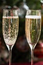 Two Champagne Flutes on Christmas Background Royalty Free Stock Photo