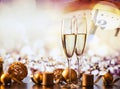 two champagne glasses against holiday lights and fireworks - new year celebration Royalty Free Stock Photo