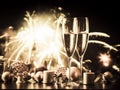 two champagne glasses against holiday lights and fireworks - new year celebration Royalty Free Stock Photo