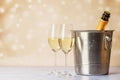 Two champagne glasses and bottle in ice bucket Royalty Free Stock Photo