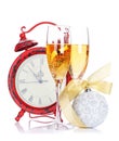 Two champagne glasses, christmas decor and clock