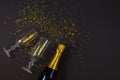 Two champagne glasses with confetti on black background Royalty Free Stock Photo