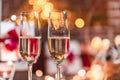 Two champagne glasses in front of christmas presents Royalty Free Stock Photo