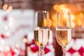 Two champagne glasses in front of christmas presents Royalty Free Stock Photo