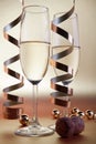 Two champagne glasses, on golden background