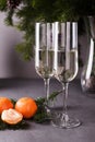 Two champagne glasses, Merry Christmas fir branchs, candles, card for new year greeting Royalty Free Stock Photo