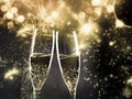 two champagne glasses ready to bring in the New Year - holiday lights and fireworks in the background Royalty Free Stock Photo