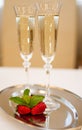 Two champaign glasses and strawberries isolated on white Royalty Free Stock Photo