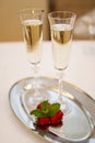 Two champaign glasses and strawberries on white Royalty Free Stock Photo