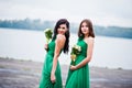 Two charmed girls bridesmaids on green dress