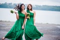 Two charmed girls bridesmaids on green dress