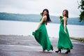 Two charmed girls bridesmaids on green dress
