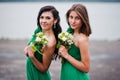 Two charmed girls bridesmaids on green dress