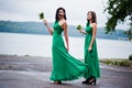 Two charmed girls bridesmaids on green dress