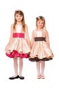 Two charming little girls in a dress