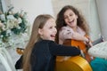 Two charming little girls with guitars