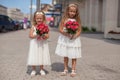 Two charming sisters with beautiful bouquets of