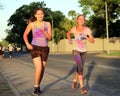 Two Chearful running teen girls covered with powder paint Royalty Free Stock Photo