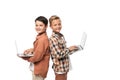 Two cheerful brothers holding laptops and looking at camera Royalty Free Stock Photo