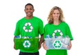 Two cheerful environmental activists holding box of recyclables Royalty Free Stock Photo