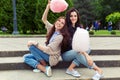 Two cheerful girls having fun with cotton candy outdoor Royalty Free Stock Photo