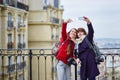 Two cheerful girls in Paris doing selfie Royalty Free Stock Photo