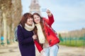 Two cheerful girls in Paris doing selfie Royalty Free Stock Photo