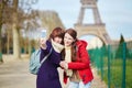 Two cheerful girls in Paris doing selfie Royalty Free Stock Photo
