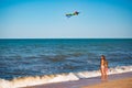 Two cheerful little girls sisters play with kite Royalty Free Stock Photo