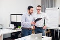 Two cheerful webdesigners standing at office Royalty Free Stock Photo