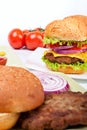 Two cheeseburgers with ingredients Royalty Free Stock Photo