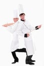 Two chefs with kitchen utensils Royalty Free Stock Photo